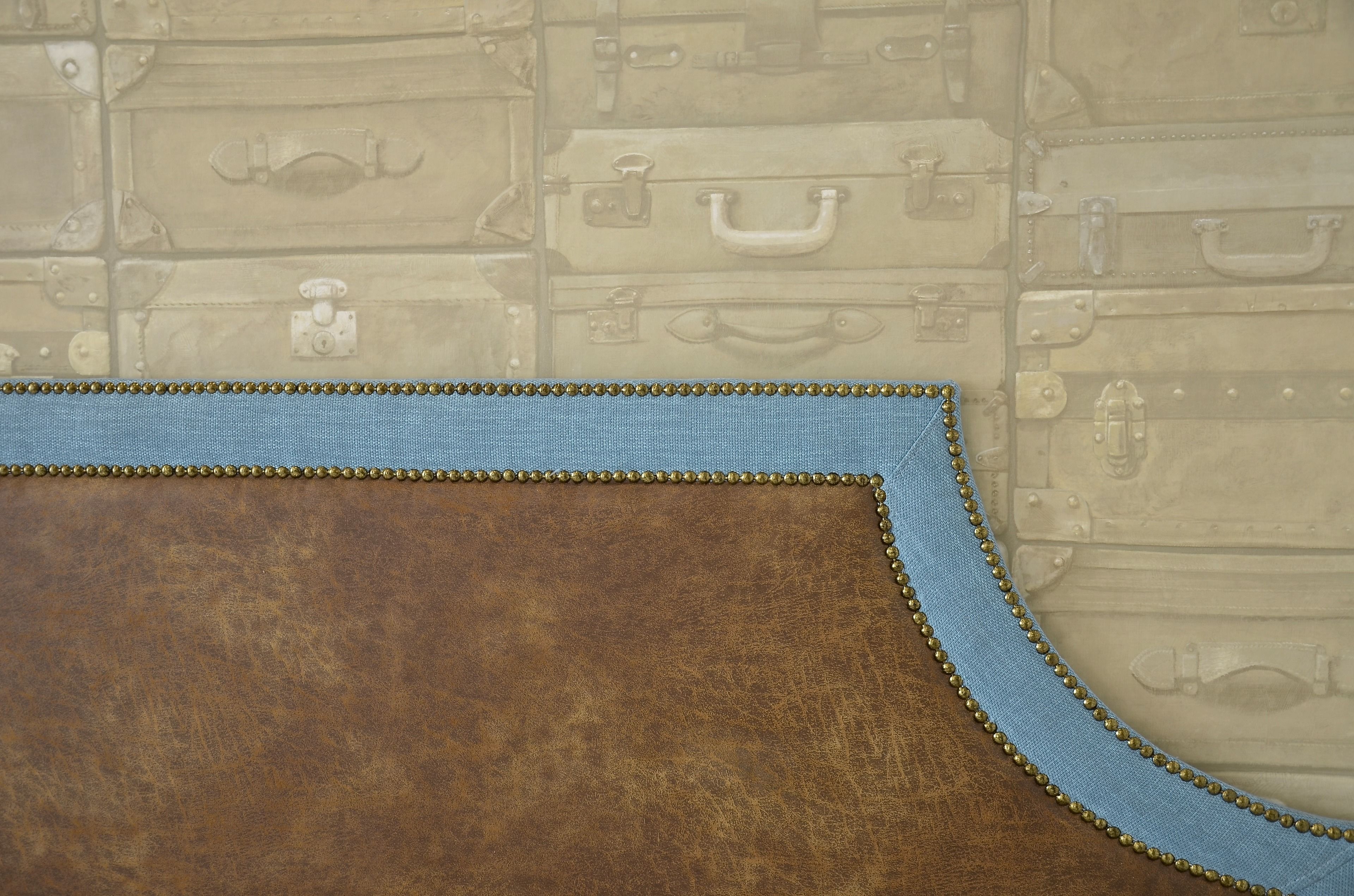 A wall with a pattern of vintage suitcases.