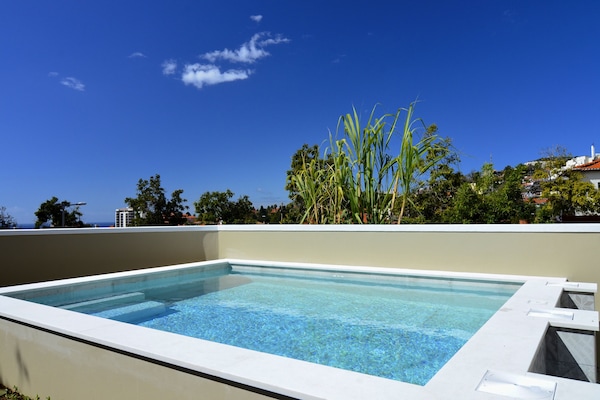 Outdoor pool, open 8:00 AM to 8:00 PM, pool umbrellas, sun loungers