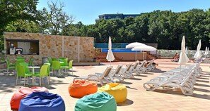 Outdoor pool, open 9:00 AM to 6:00 PM, pool umbrellas, pool loungers
