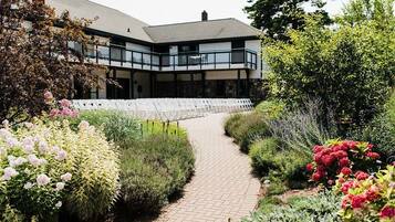 Stroll along the garden pathway to the building's entrance.