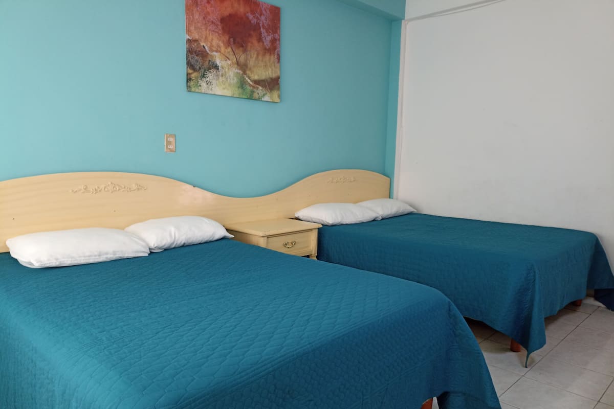 Quadruple Room | In-room safe, desk, free WiFi, bed sheets