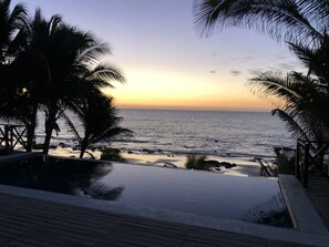 Outdoor pool, an infinity pool, pool loungers