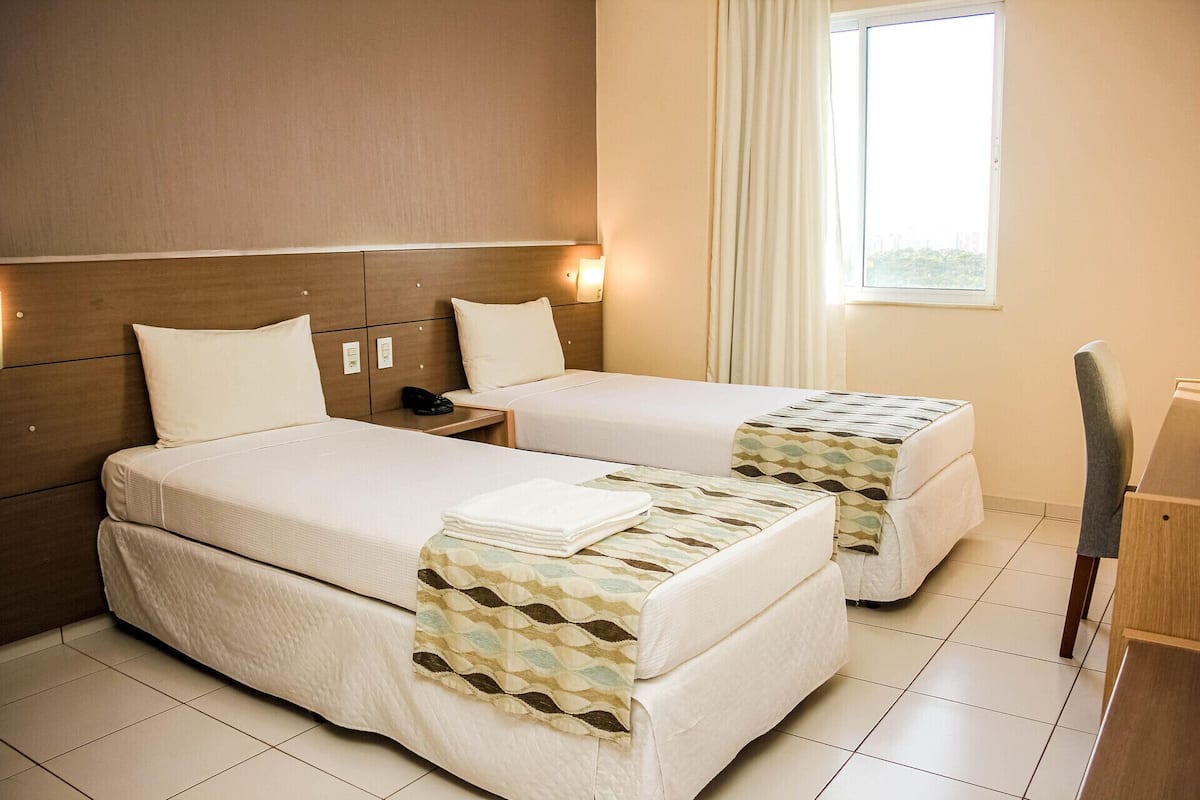 Minibar, desk, blackout curtains, travel cot