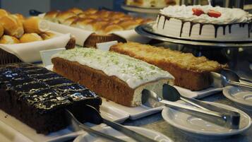 A variety of cakes and pastries on display.