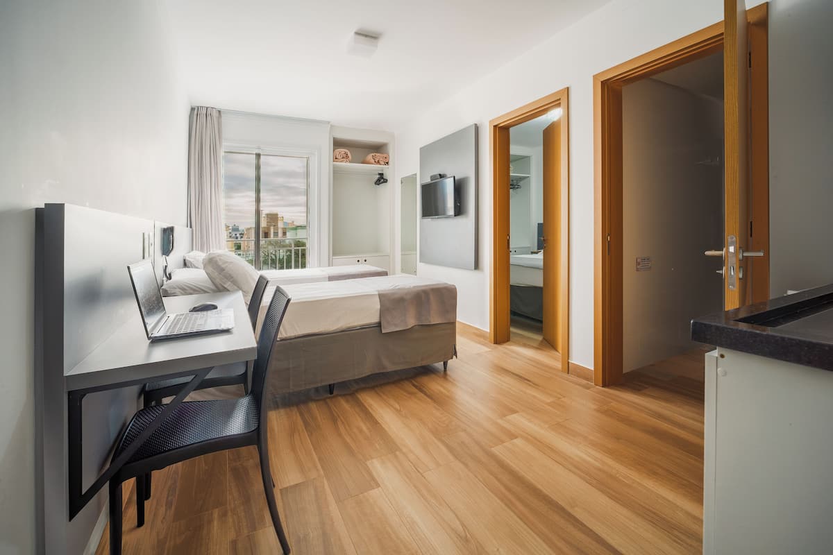 Quadruple room with 2 rooms | Minibar, in-room safe, laptop workspace, blackout drapes