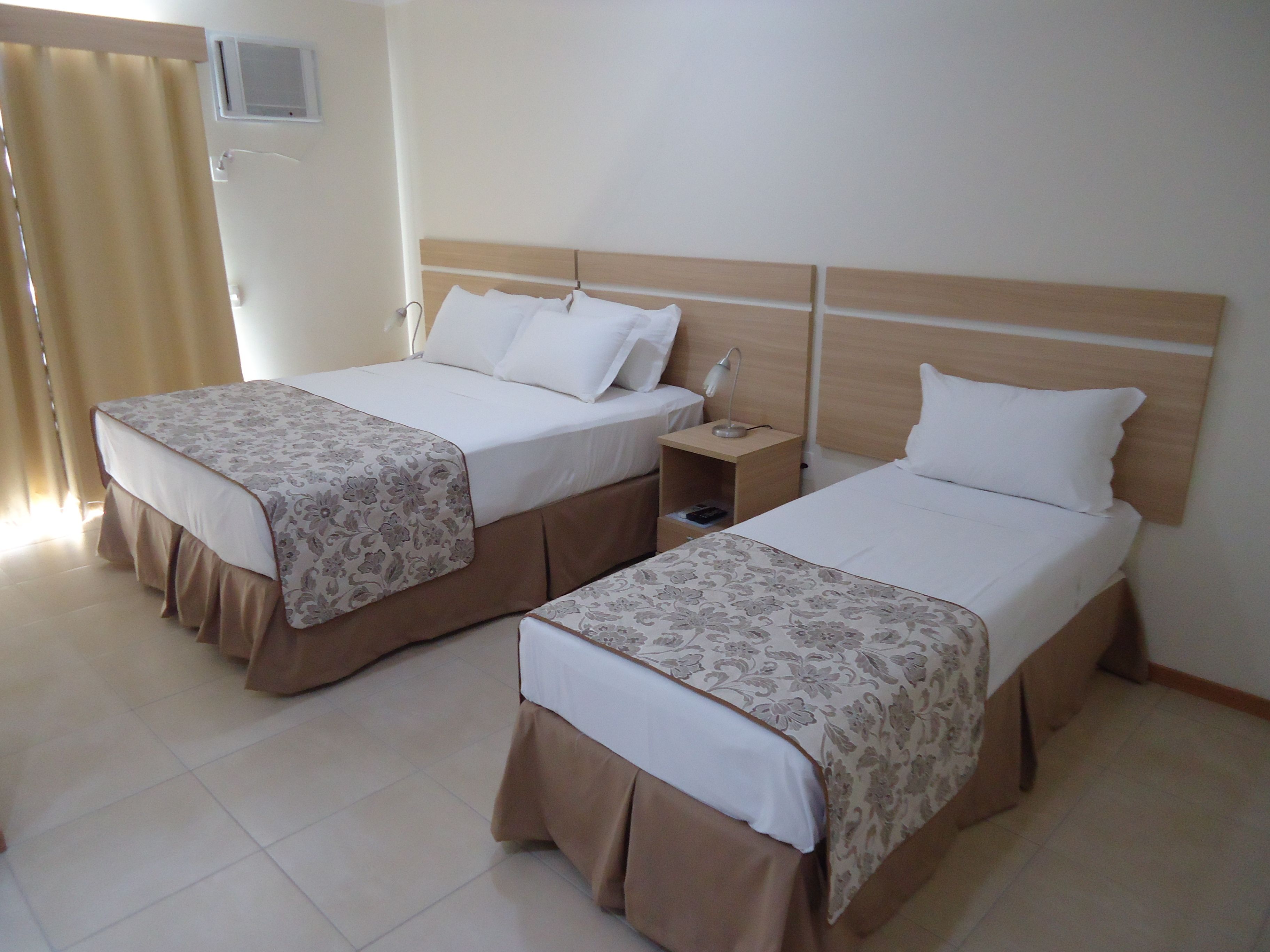 standard triple room | 1 bedroom, minibar, in-room safe, laptop workspace