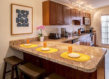 Signature Suite, Kitchen, Pool View | Private kitchen | Fridge, microwave, coffee/tea maker at Avance Hotel