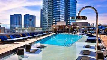 Outdoor pool, open 6:00 AM to 10:00 PM, sun loungers