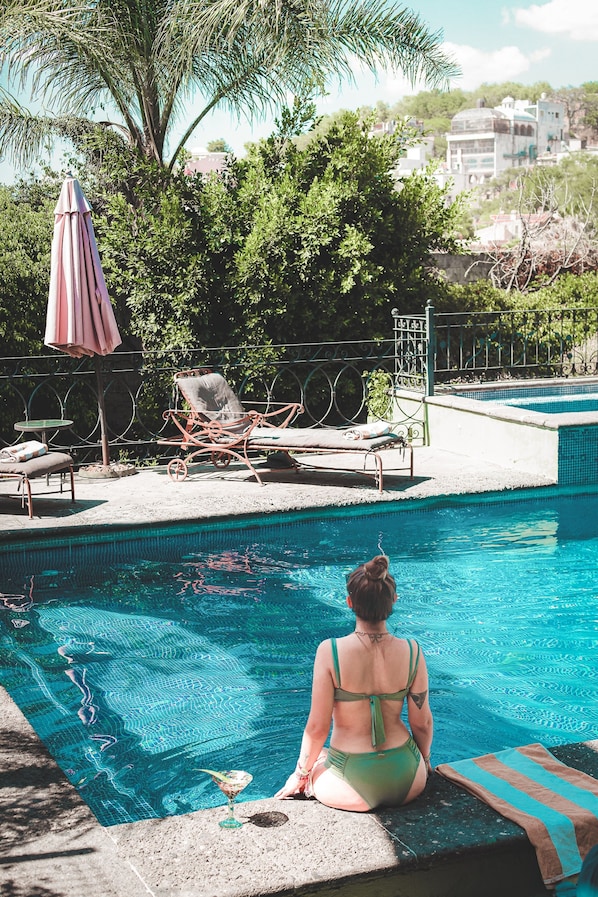 Outdoor pool, open 8 AM to 7 PM, pool umbrellas, sun loungers