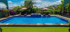 Outdoor pool, open 8 AM to 7 PM, pool umbrellas, pool loungers