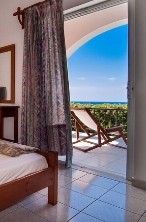 Apartment, 2 Bedrooms, Sea View | In-room safe, soundproofing, iron/ironing board, free cribs/infant beds