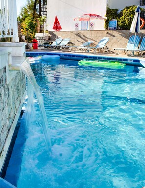 Outdoor pool, pool umbrellas, sun loungers