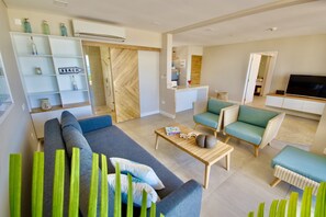 Grand Apartment | Living area | 50-inch LCD TV with cable channels, TV, DVD player - Le Domaine de Bacova (Mahé Island)