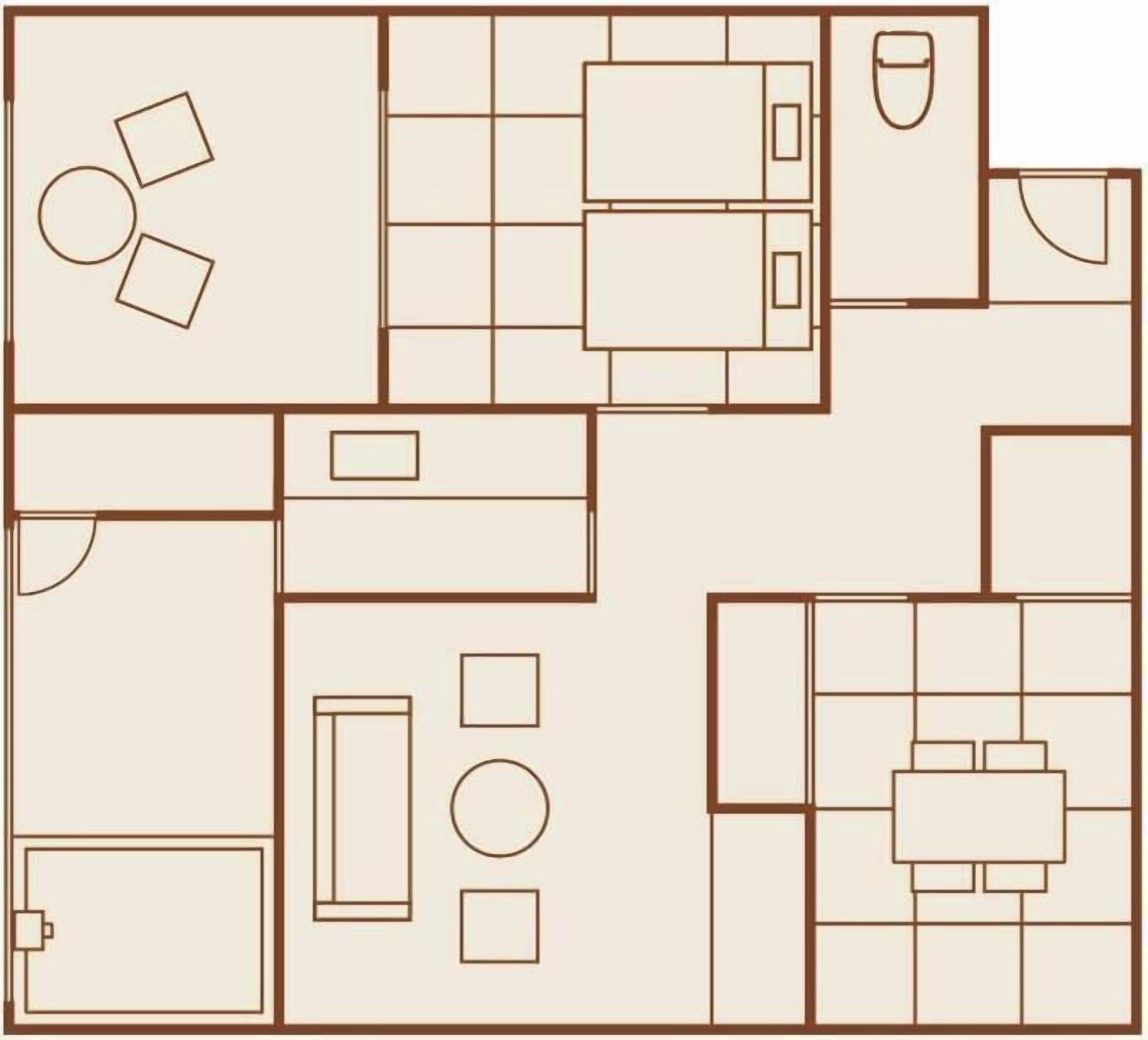 Distribución de una habitación de hotel con cama, zona de estar y una pequeña kitchenette.