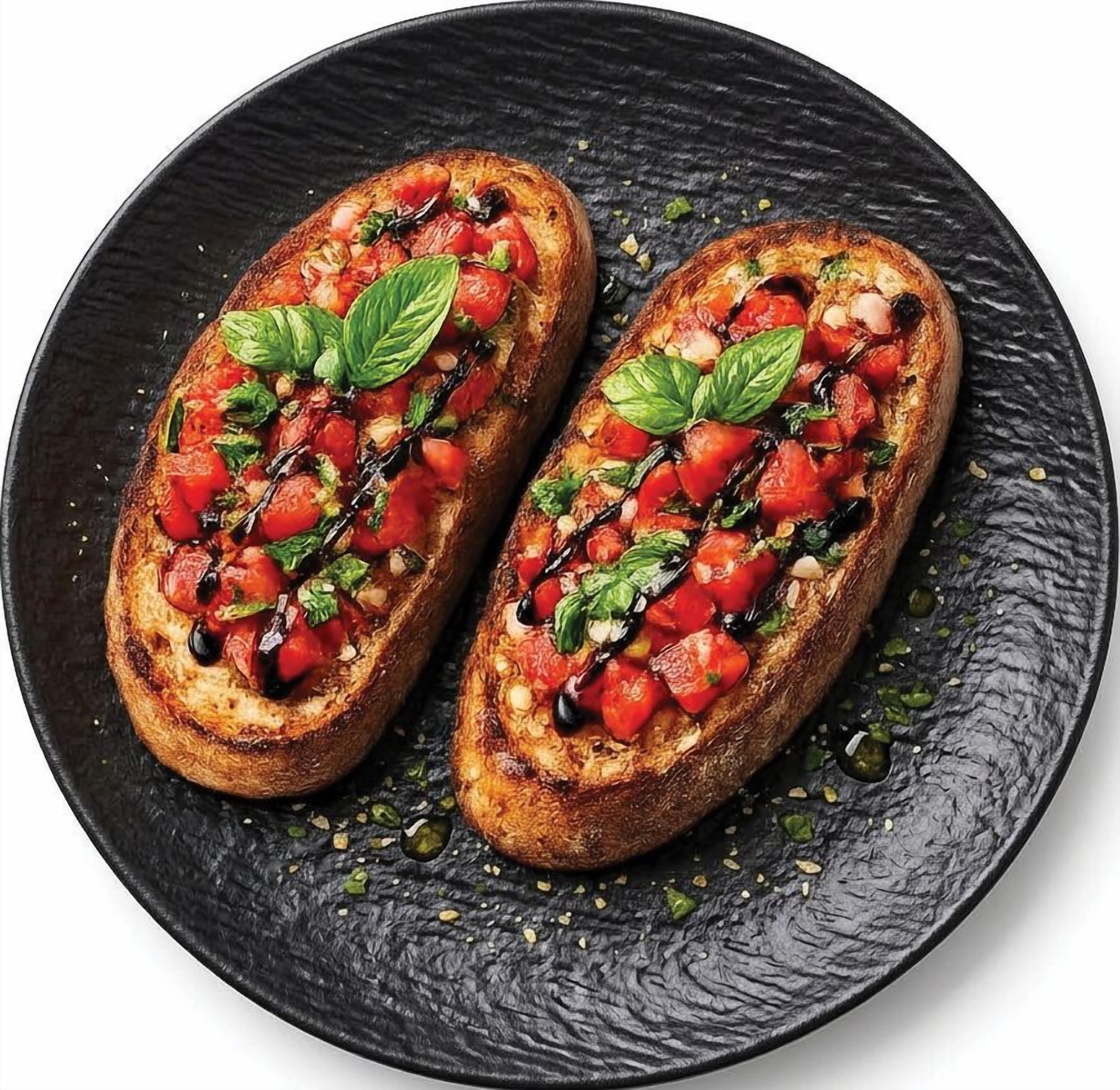 Zwei Bruschetta auf einem schwarzen Teller.