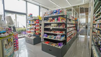 A clean, well-lit store with shelves stocked with various products.