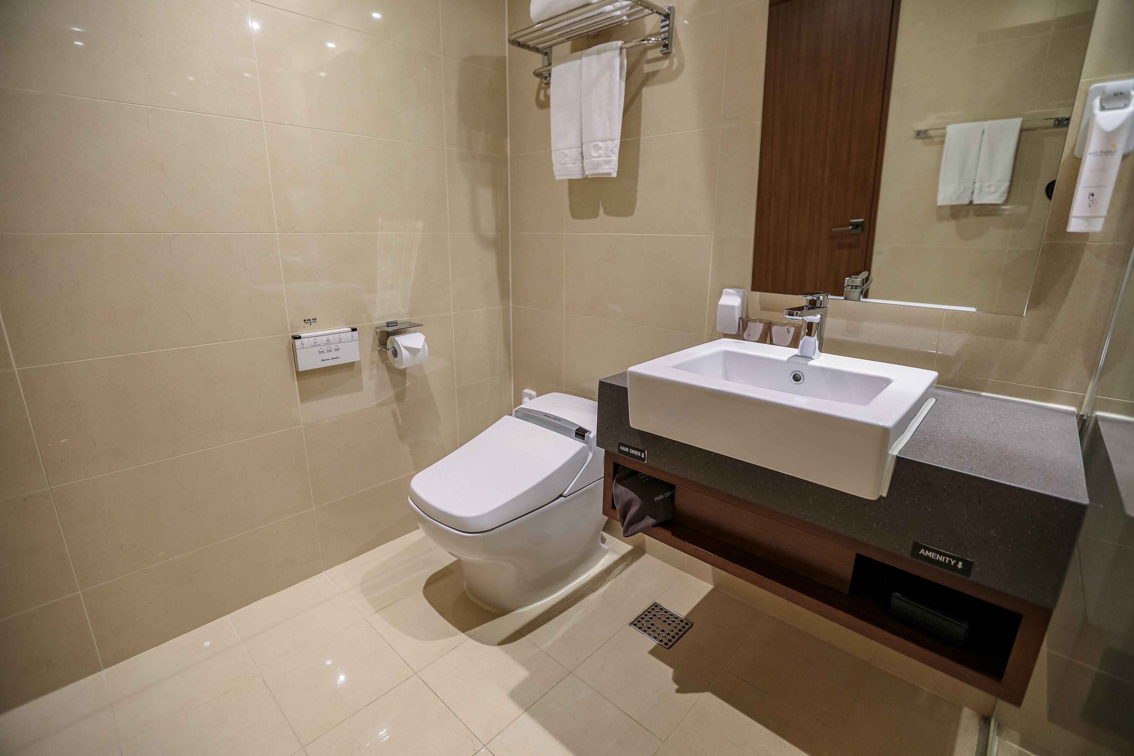 shower, hair dryer, slippers, bidet