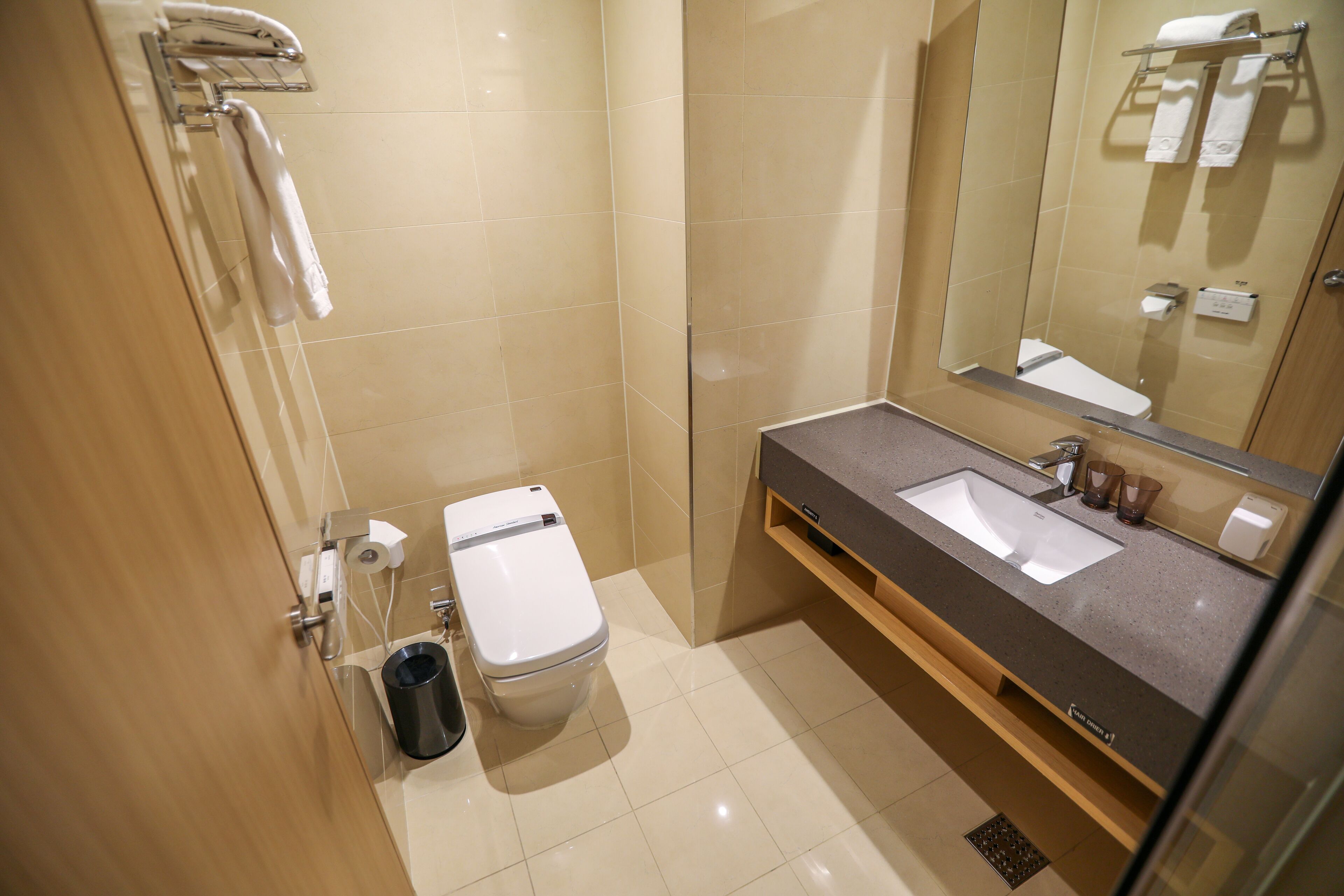 shower, hair dryer, slippers, bidet