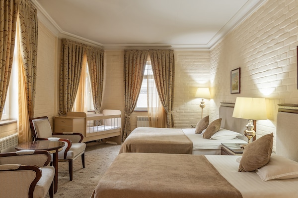 Suíte, 1 quarto | 1 quarto, roupas de cama premium, frigobar, cofres nos quartos