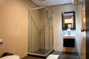 Family Quadruple Room, 2 Queen Beds | Bathroom | Shower, free toiletries, hair dryer, bidet - M Citi Suites (Cebu City)