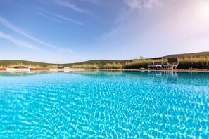 Seasonal outdoor pool, open 8:00 AM to 8:30 PM, pool umbrellas