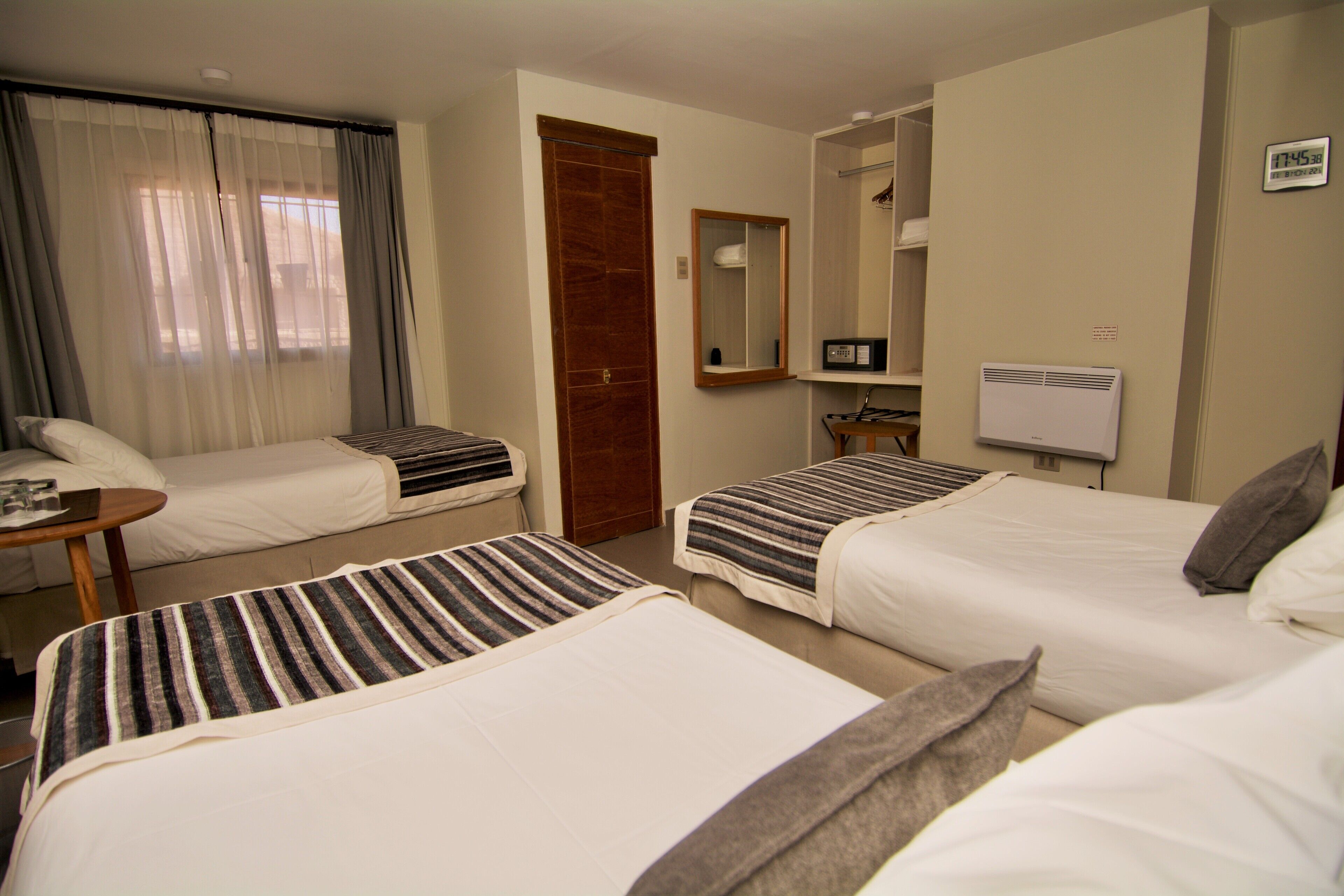 triple room | premium bedding, pillow-top beds, in-room safe, blackout curtains