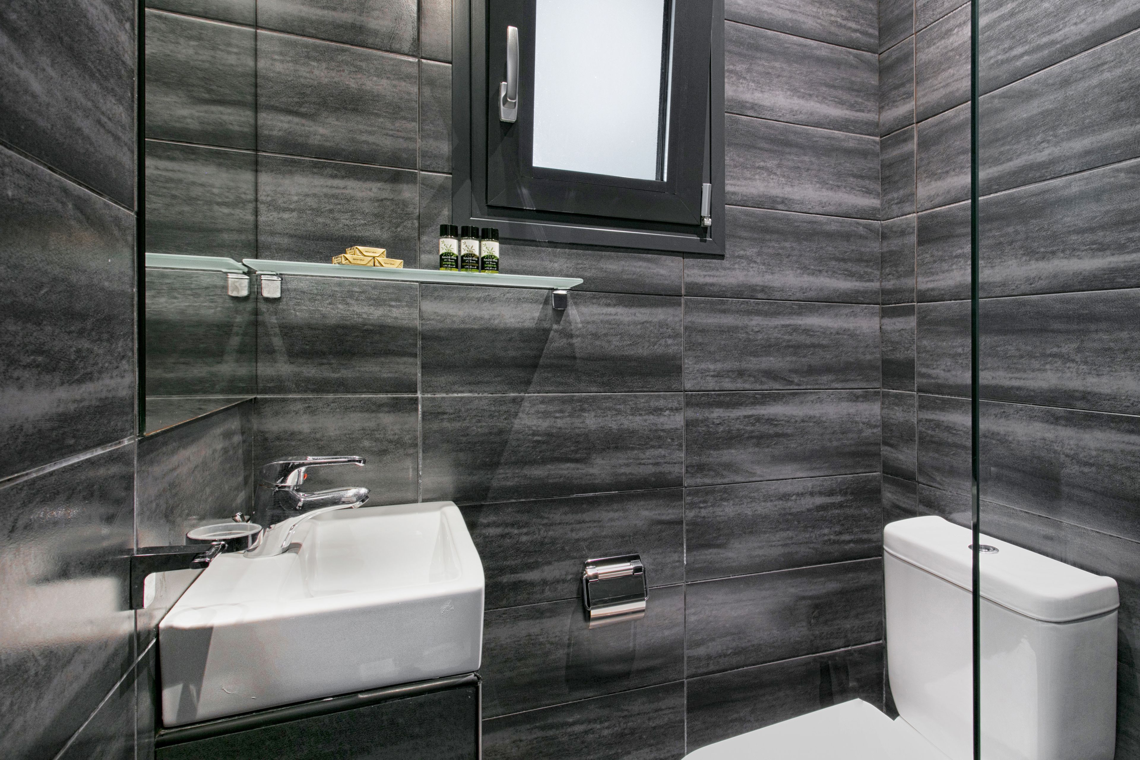 shower, hair dryer, slippers, towels