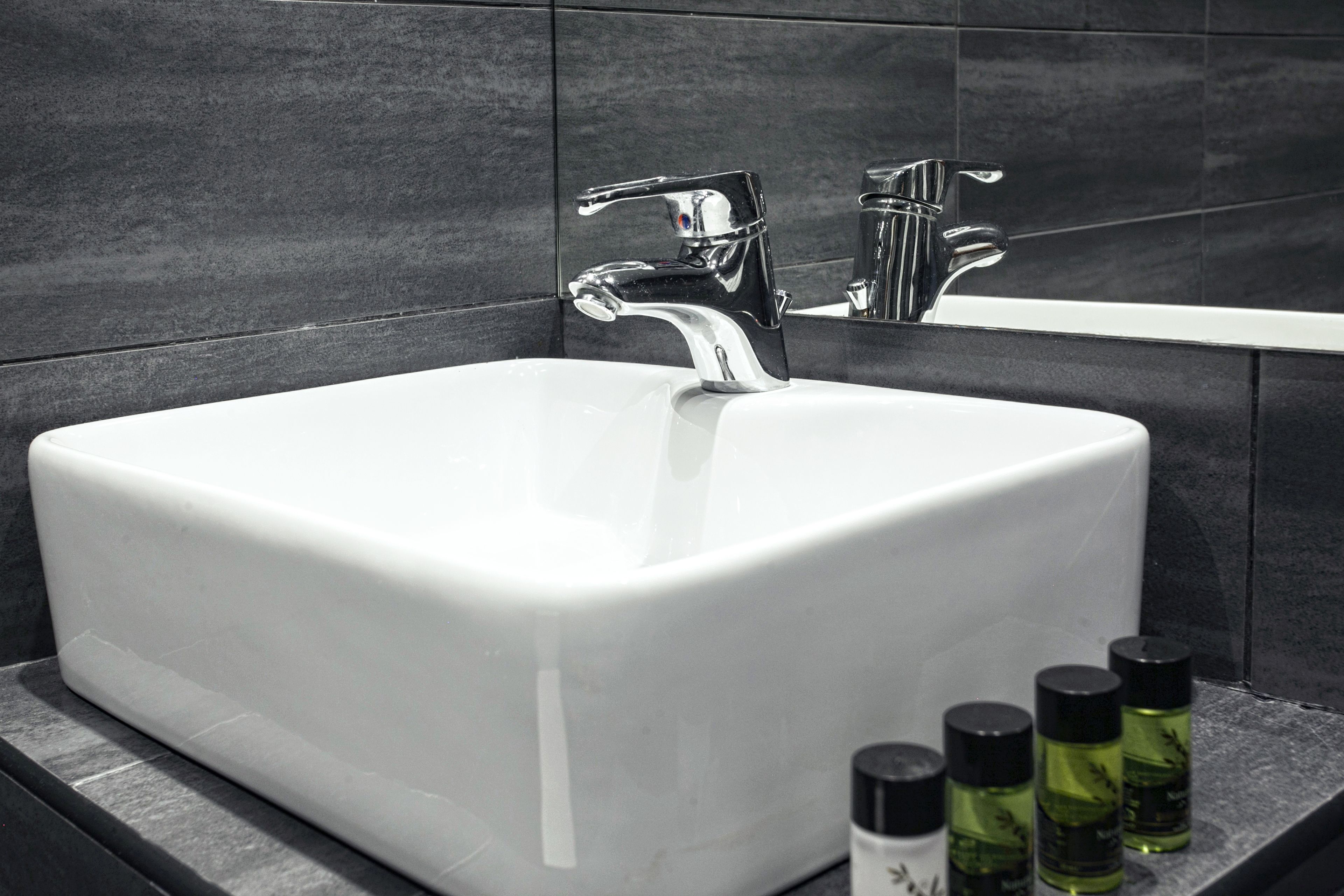 shower, hair dryer, slippers, towels