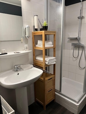 Shower, free toiletries, hair dryer, slippers