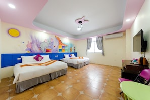 A hotel room with two beds, a TV, a desk, and a colorful mural on the wall. - Kenting Aqual Inn (Hengchun)