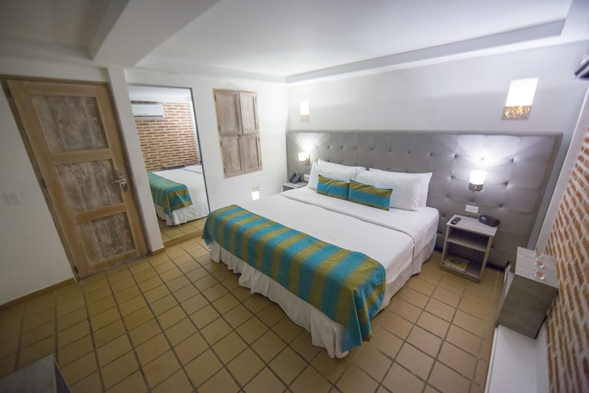 Deluxe Double Room | 1 bedroom, bed sheets
