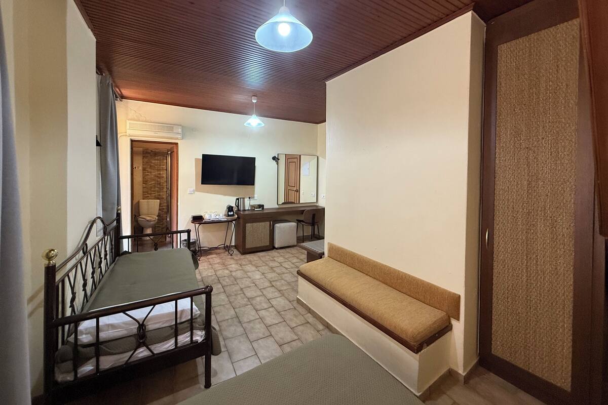 Standard Triple Room | Desk, laptop workspace, blackout drapes, iron/ironing board (on request)