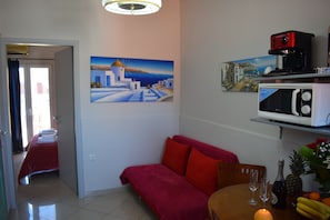 Superior Apartment, Terrace, City View | Living room | Flat-screen TV - Alena Apartments (Chania)