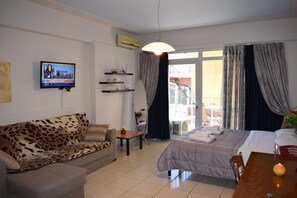 Standard Apartment, Balcony, City View | Living area | Flat-screen TV - Alena Apartments (Chania)