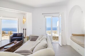 Premier Villa, 4 Bedrooms | Living area | 36-inch flat-screen TV with cable channels, TV, fireplace - Villa Aquata by Mermaid Luxury Villas (Mykonos)