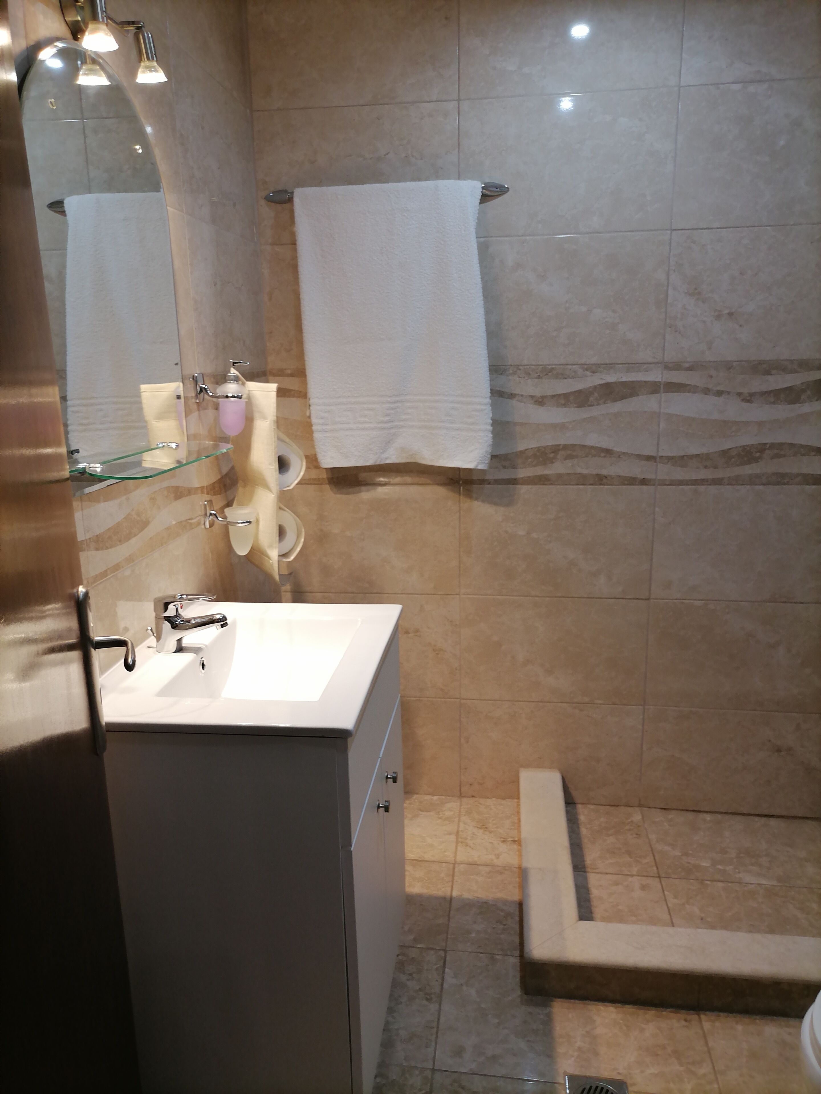 mini suite garden view | bathroom | rainfall showerhead, hair dryer, towels, soap