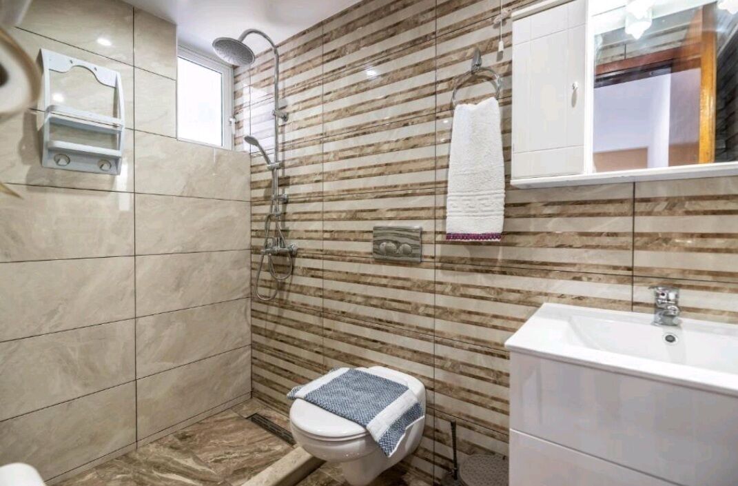 mini suite garden view | bathroom | rainfall showerhead, hair dryer, towels, soap