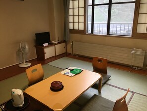 In-room safe, bed sheets - Sapporo’s Secret Onsen Sanctuary Marukoma Onsen Ryokan (Chitose)