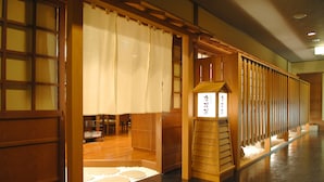 A traditional Japanese interior with sliding doors, tatami flooring, and a shoji screen. - Sapporo’s Secret Onsen Sanctuary Marukoma Onsen Ryokan (Chitose)