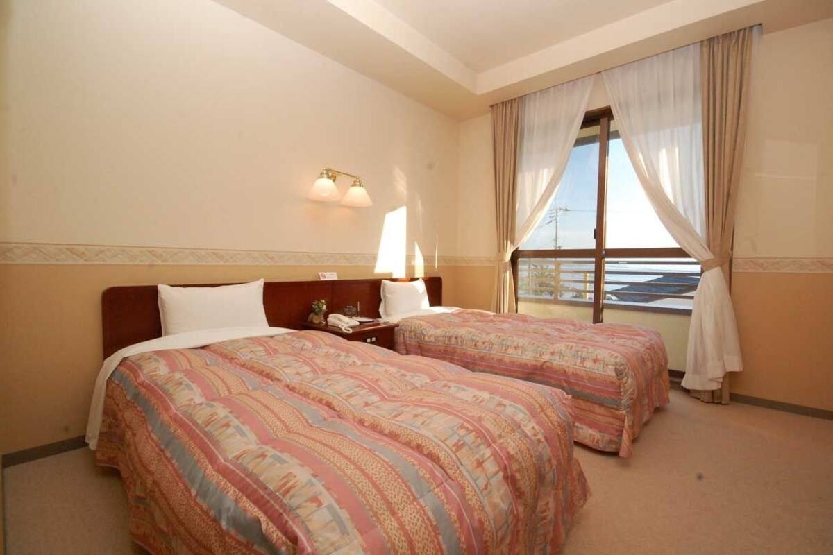 Standard Twin Room, Beach View | In-room safe, desk, free WiFi