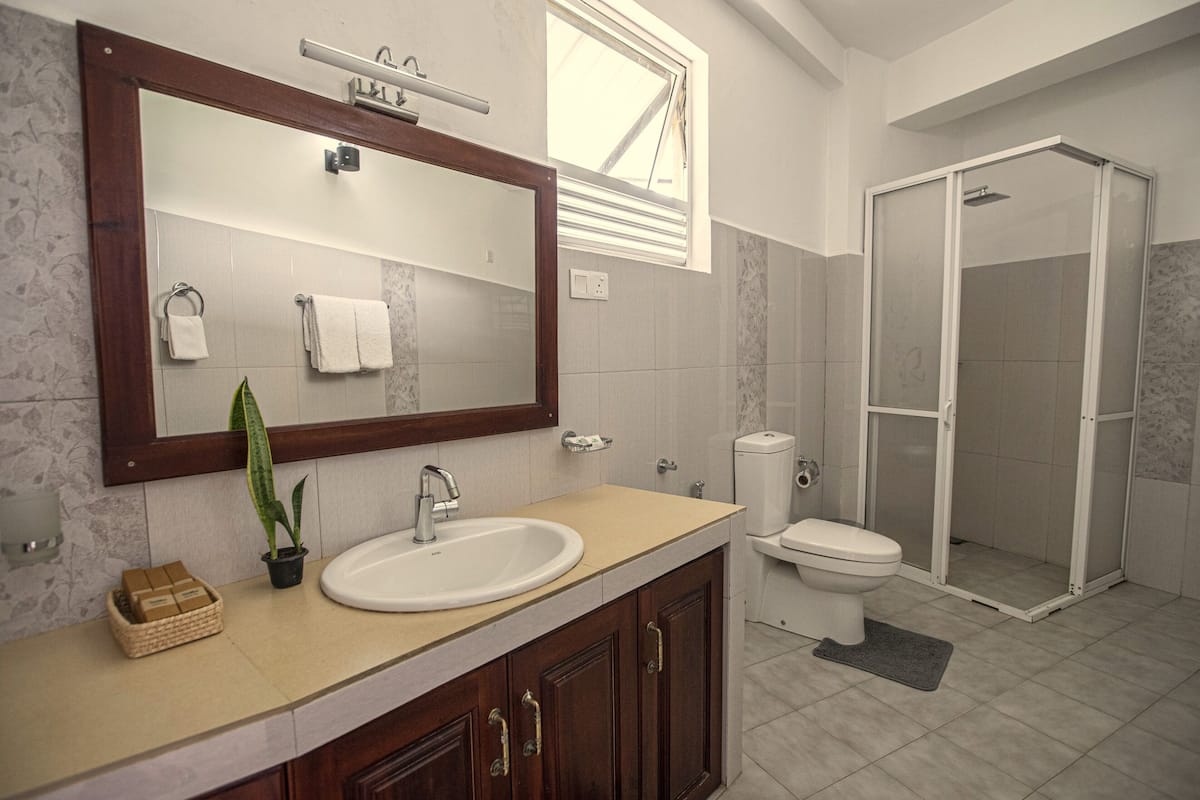 superior quadruple room | bathroom | shower, rainfall showerhead, designer toiletries, hair dryer
