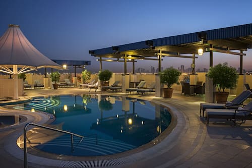 Outdoor pool, open 8:00 AM to 6:00 PM, pool loungers