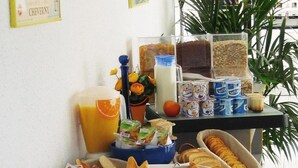 A breakfast buffet with various food items and beverages. - Hotel Noctuel - Blois (Saint-Gervais-la-Foret)