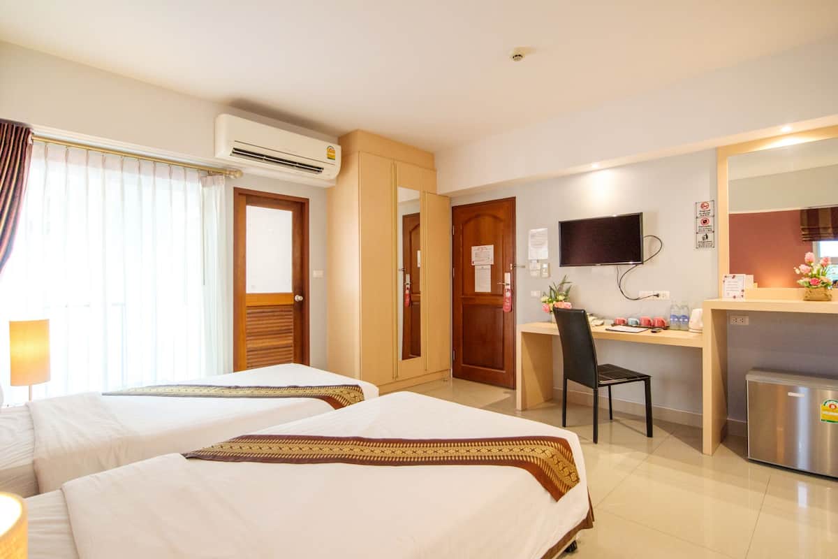 Standard Twin Room | In-room safe, individually decorated, desk, laptop workspace