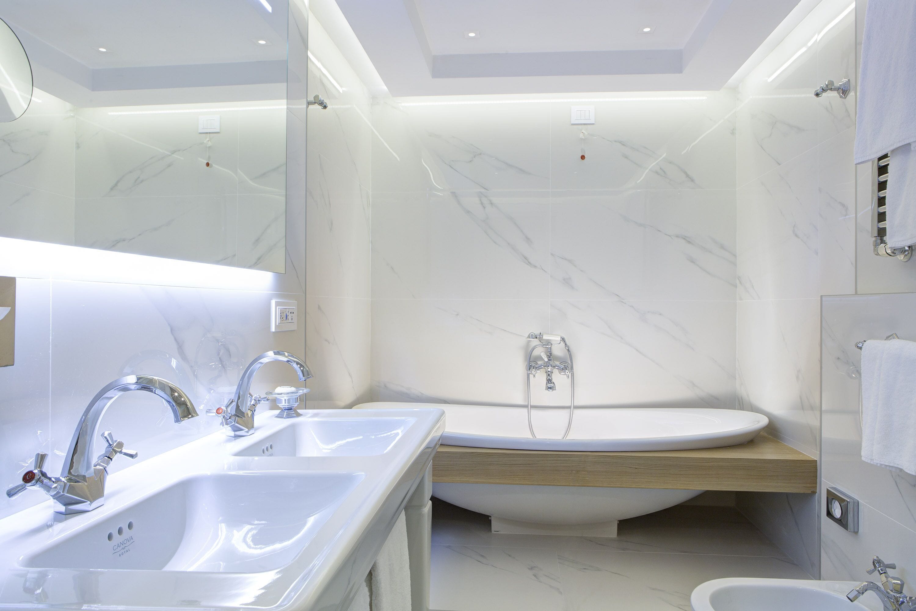 sky suite | bathroom | shower, free toiletries, hair dryer, slippers