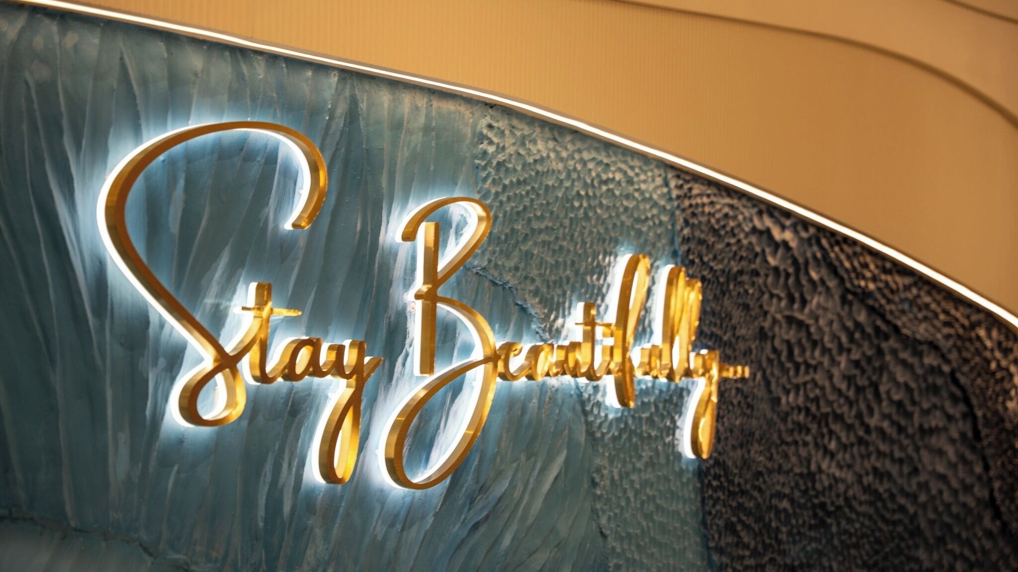 A sign with the text 'Stay Beautiful' in a stylized font.