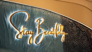 A sign with the text 'Stay Beautiful' in a stylized font.