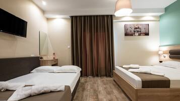 Habitación cuádruple, no fumadores | Ropa de cama de alta calidad y edredones de plumas