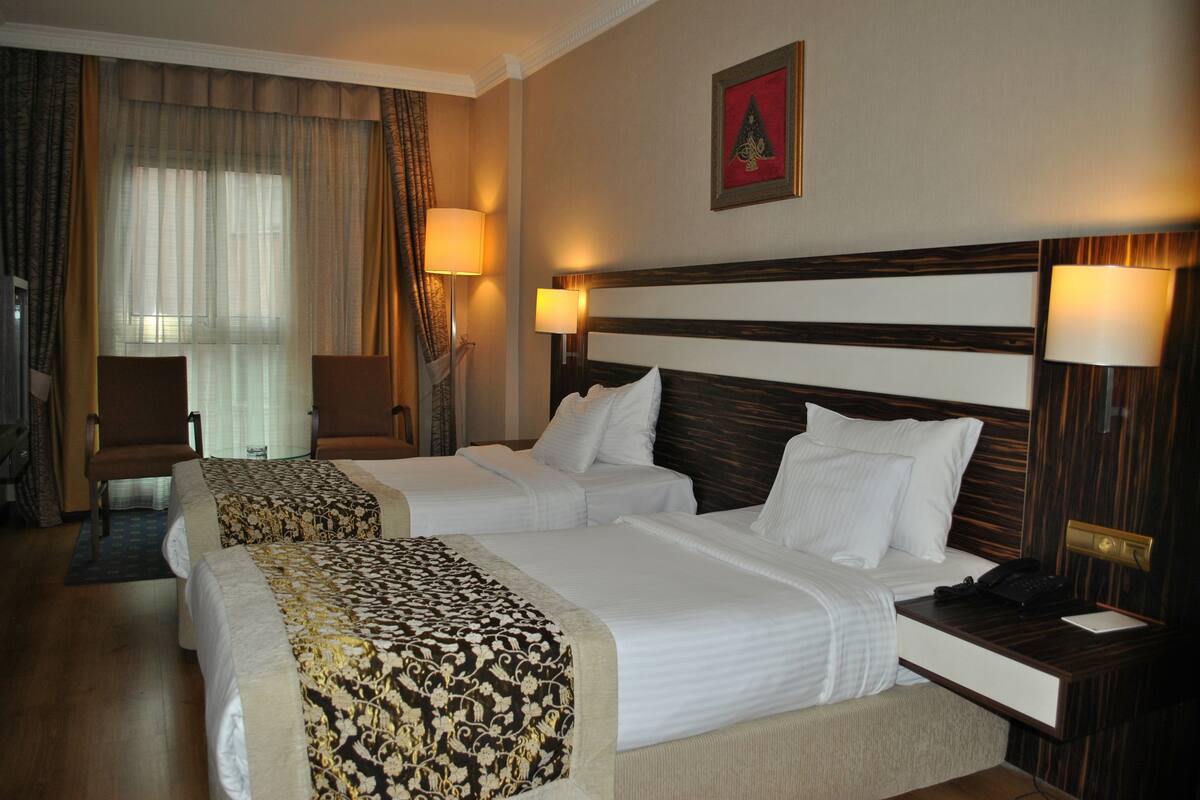 Double or Twin Room | Minibar, in-room safe, desk, cribs (free)