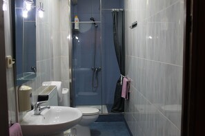 Shower, towels, soap, toilet paper